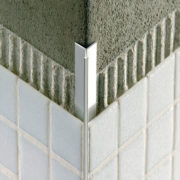 Corner trim to protect tile edges